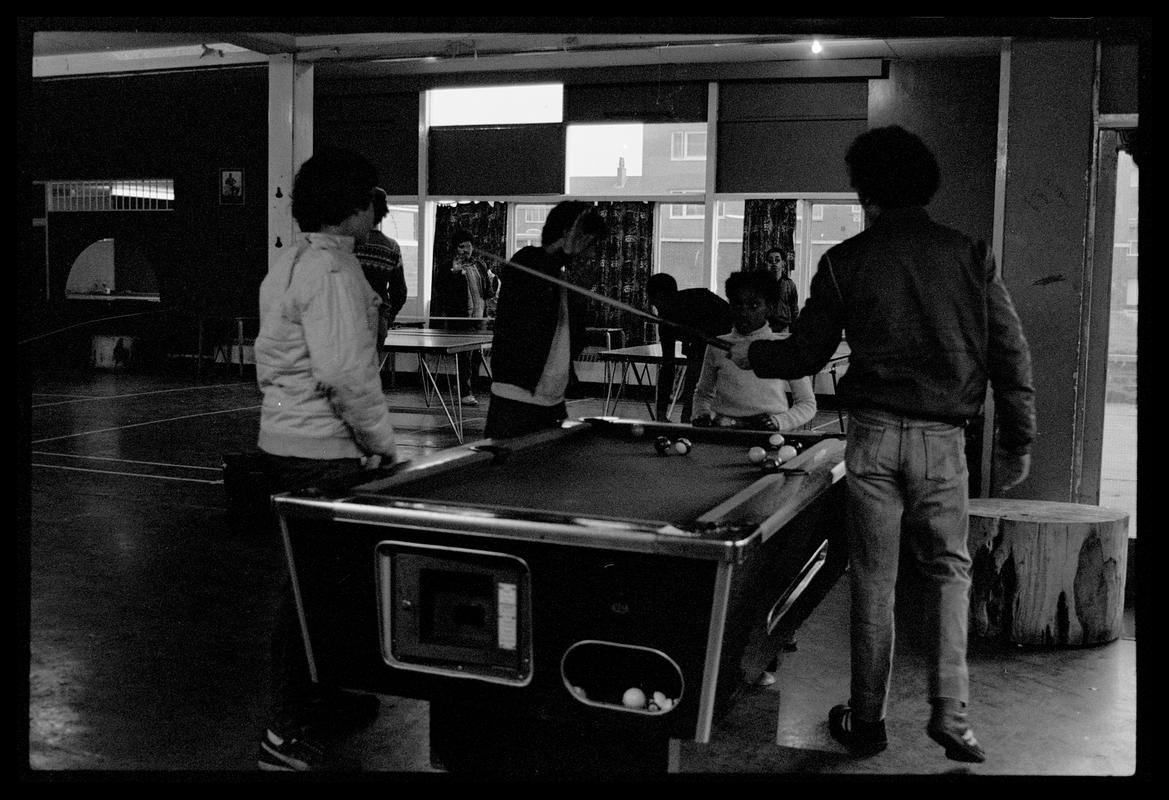 Teenagers playing pool at Butetown Youth Club.