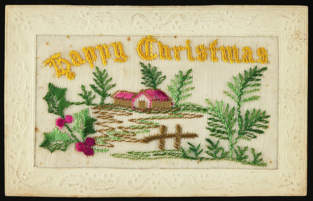 Embroidered postcard inscribed 'Happy Christmas'. Handwritten message on back. Sent to Miss Evelyn Hussey, sister of Corporal Hector Hussey of the Royal Welch Fusiliers, during the First World War.