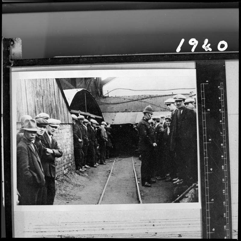 Black and white film negative of a photograph showing miners on the surface, Milfraen Colliery, Blaenavon.  'Milfraen' is transcribed from original negative bag.