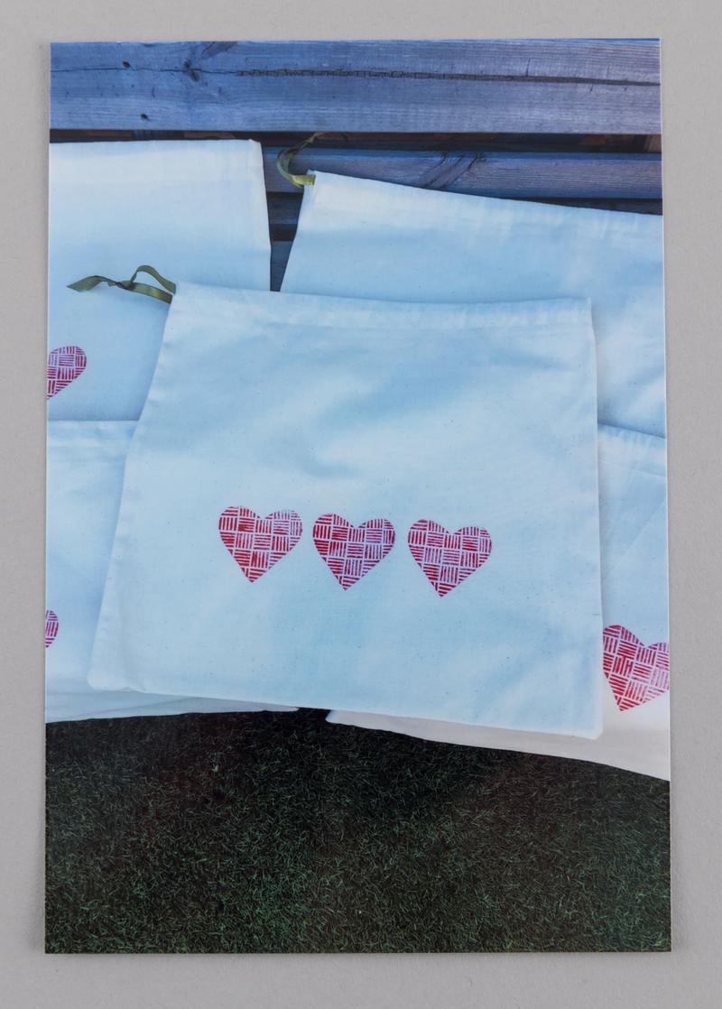 Scrub bag with three printed hearts