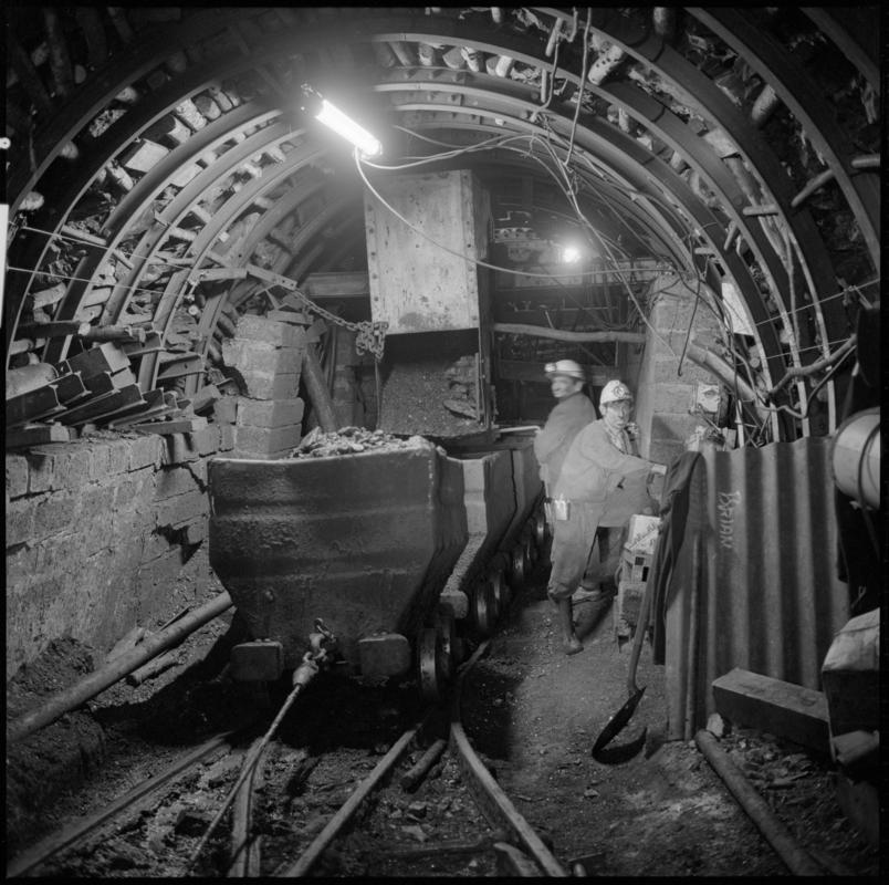 Black and white film negative showing an underground transfer point, Ammanford Colliery 7 September 1976.  'Ammanford 7 Sep 1976' is transcribed from original negative bag.