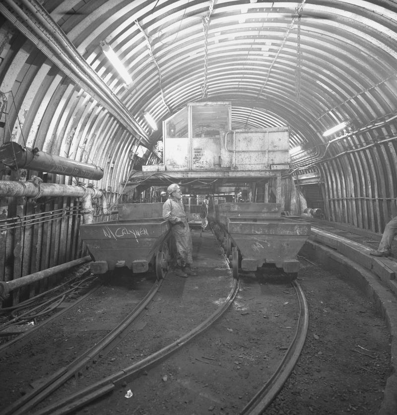 Black and white film negative showing men and drams at pit bottom, Oakdale Colliery, May 1980.  'Oakdale May 1980' is transcribed from original negative bag.