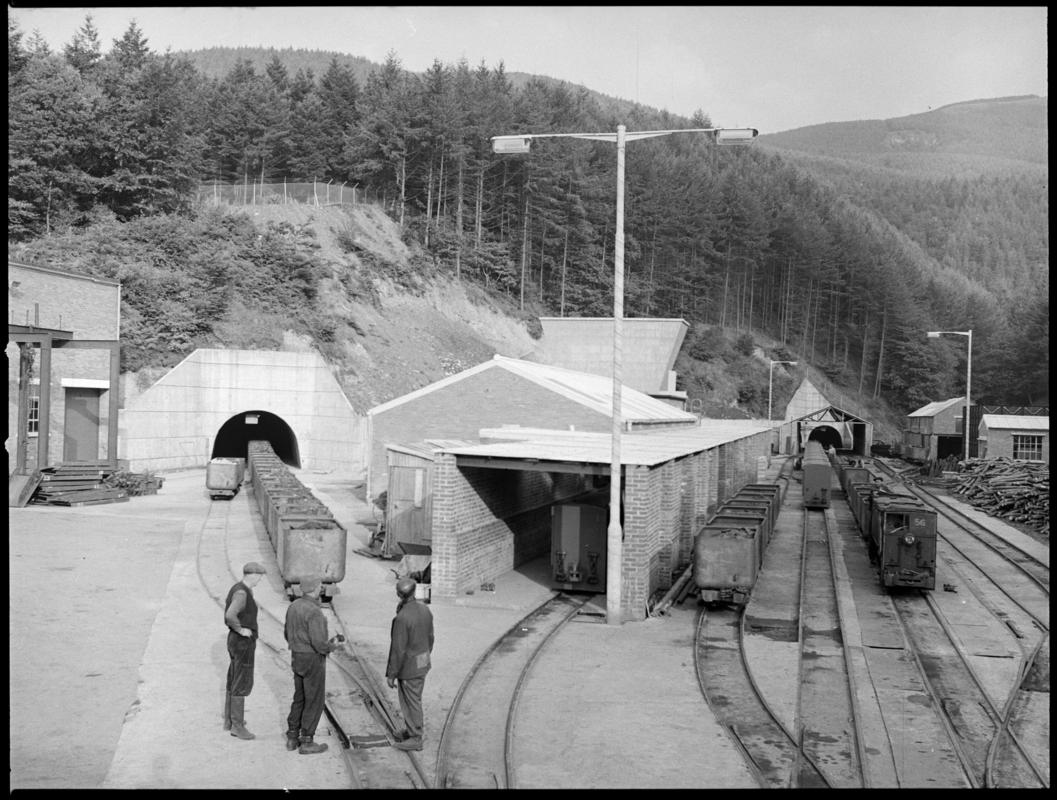 Black and white film negative showing full coal drams arriving on the surface, Hafodyrynys Colliery.