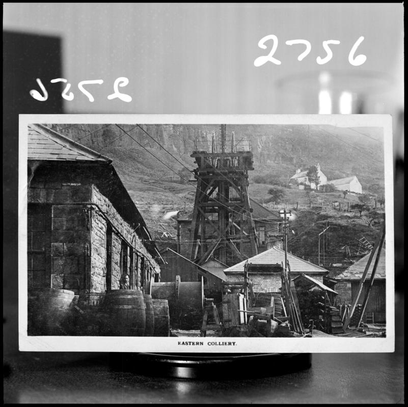 Black and white film negative of a photograph showing a surface view of Eastern Colliery. 'Eastern' is transcribed from original negative bag.