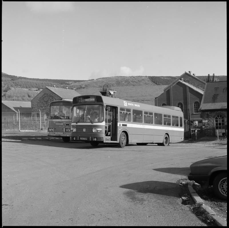 Black and white film negative showing two buses at St John's Colliery.