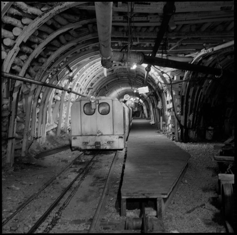 Black and white film negative showing an electric locomotive underground at Cwmtillery Colliery 22 November 1977.  'Cwmtillery, 22 November 1977' is transcribed from original negative bag.