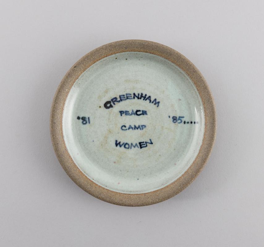 Plate produced and sold by Will and Clare Marno, of Towy Pottery, Rhandirmwyn, to raise funds in support of Greenham Common Women's Peace Camp.