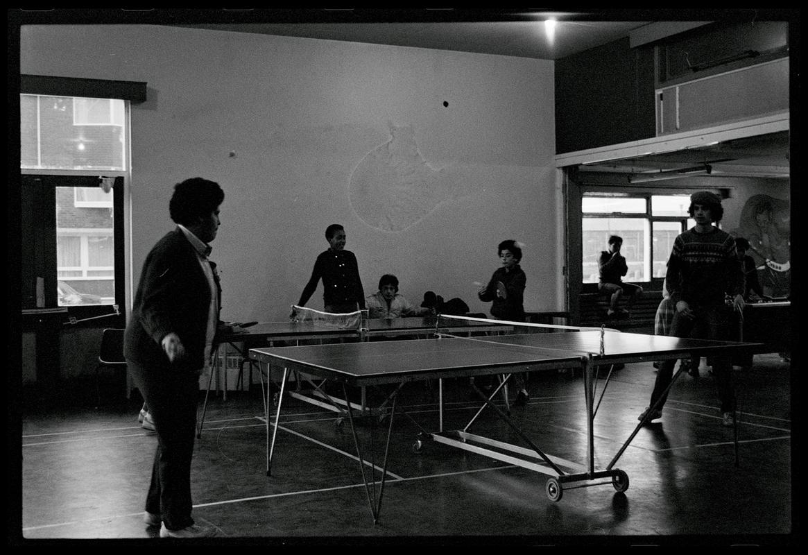 Teenagers playing table tennis at Butetown Youth Club.