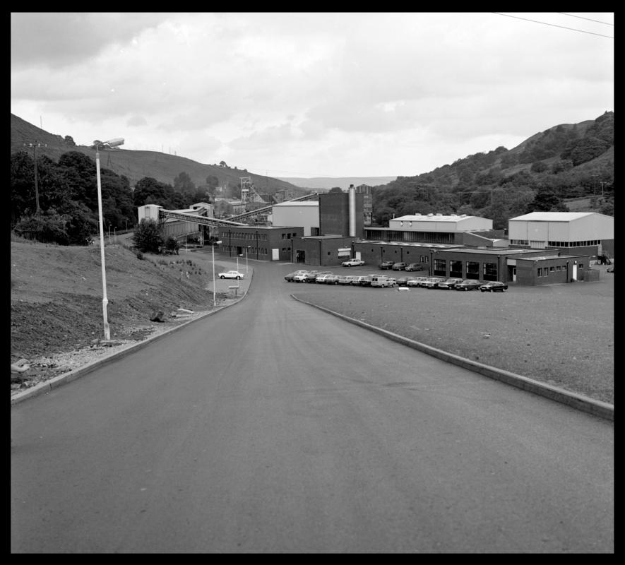 Black and white film negative showing Trelewis Mine offices with Taff Merthyr Colliery in the background.