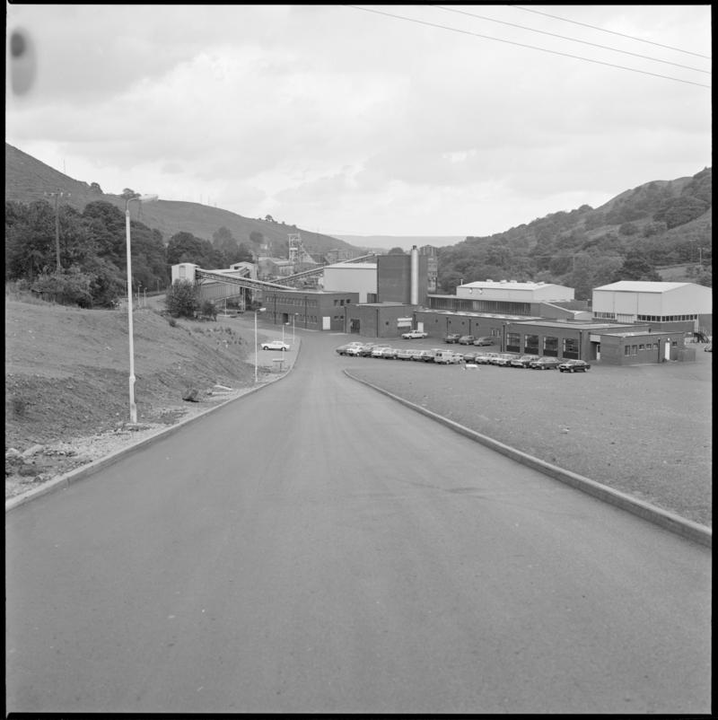 Black and white film negative showing Trelewis Mine offices with Taff Merthyr Colliery in the background.  'Trelewis' is transcribed from original negative bag.