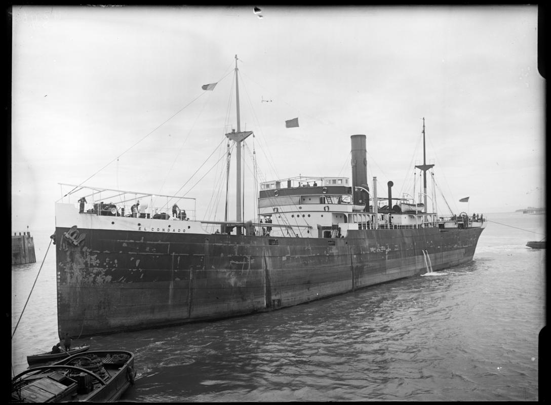 Three quarter Port bow view of S.S. EL CONDADO and waterman's boat, c.1936.