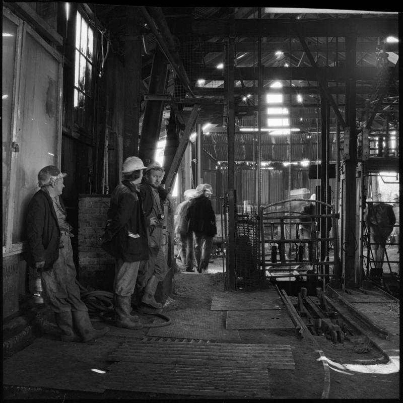 Black and white film negative showing men at pit top, Morlais Colliery 13 May 1981.  'Morlais 13/5/81' is transcribed from original negative bag.