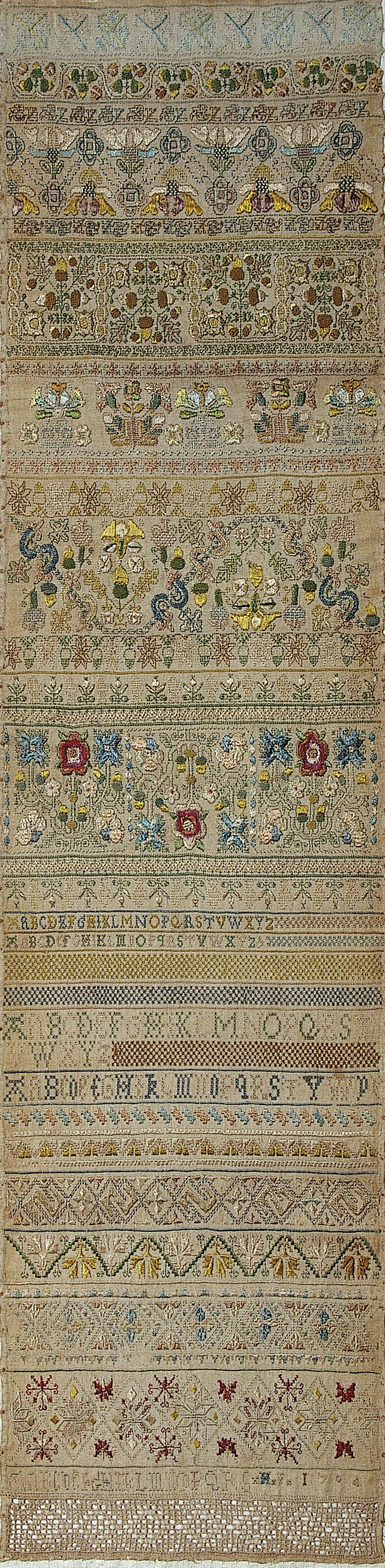 Sampler (motifs, stitches & alphabet), made in England, 1704