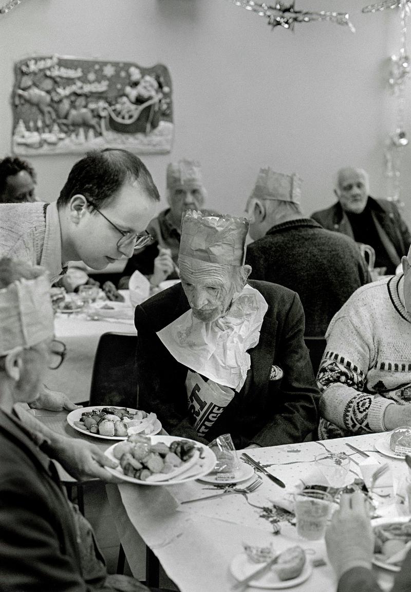 GB. WALES. Cardiff. Bute Town - once known as 'Tiger Bay'. Christmas Dinner at the Salvation Army Hostel, Bute Street. 1997