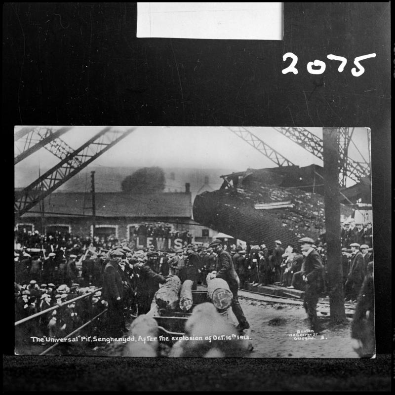 Black and white film negative of a photograph showing the scene at Universal Colliery, Senghenydd after the explosion of 14 October 1913.  Caption on photograph reads 'the Universal Pit, Senghenydd.  After the explosion of Oct 14th 1913.