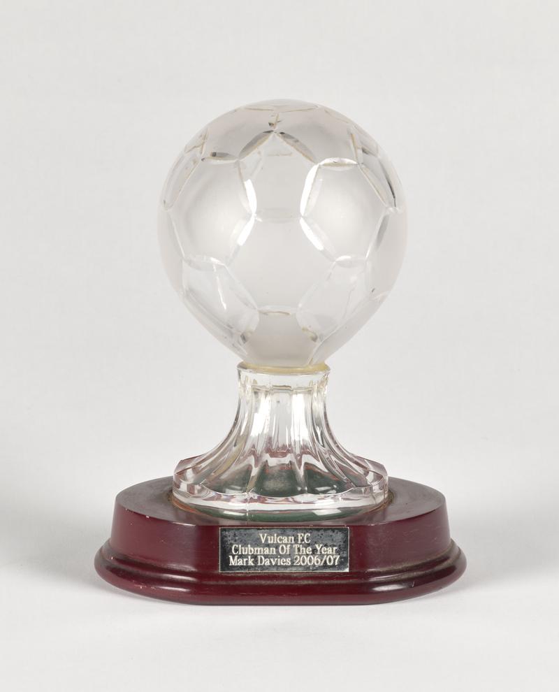 Glass football trophy with the text ‘Vulcan FC Clubman of the year, Mark Davies 2006/7’