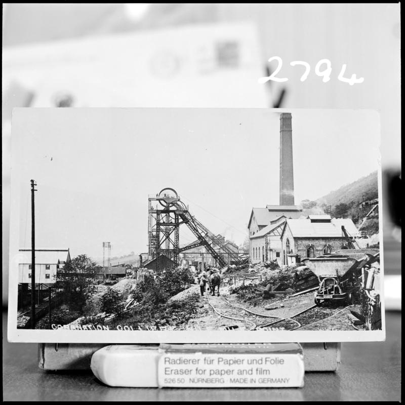 Black and white film negative of a photograph showing a surface view of Nine Mile Point Colliery, Cwmfelinfach. 'Nine Mile Point early photo' is transcribed from original negative bag.