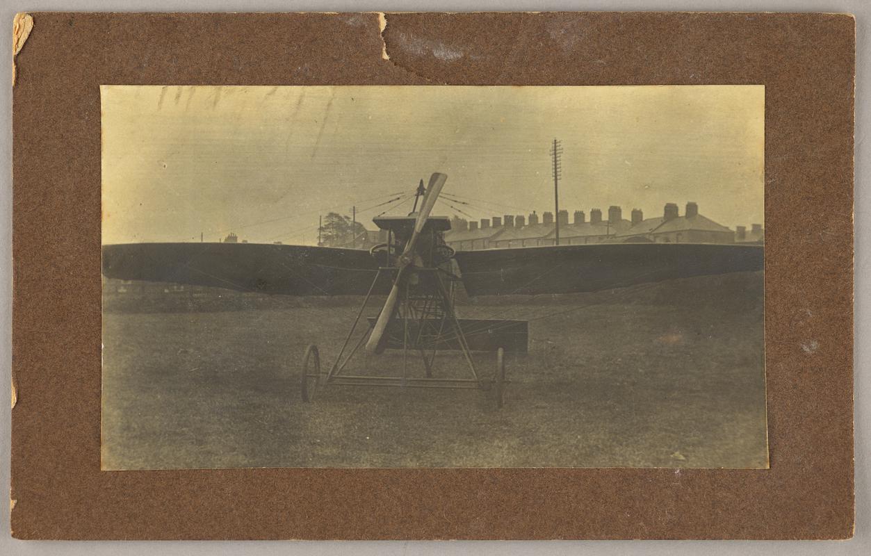 Photograph of Watkins monoplane at Mynachdy Farm, Cardiff. Mounted on card. Inscription on reverse.