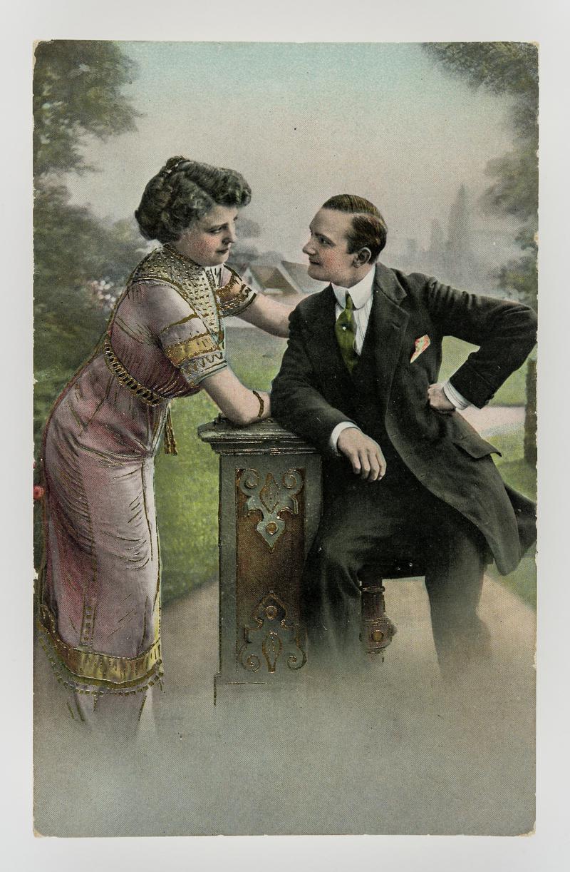 Tinted photograph of couple looking at each other with studied concentration.