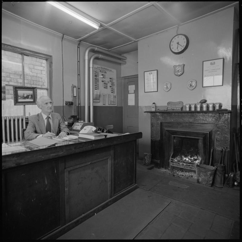 Black and white film negative showing Glyn Morgan, the last NCB manager, in his office, Big Pit Colliery 28 November 1980.  '28 Nov 1980' is transcribed from original negative bag.
