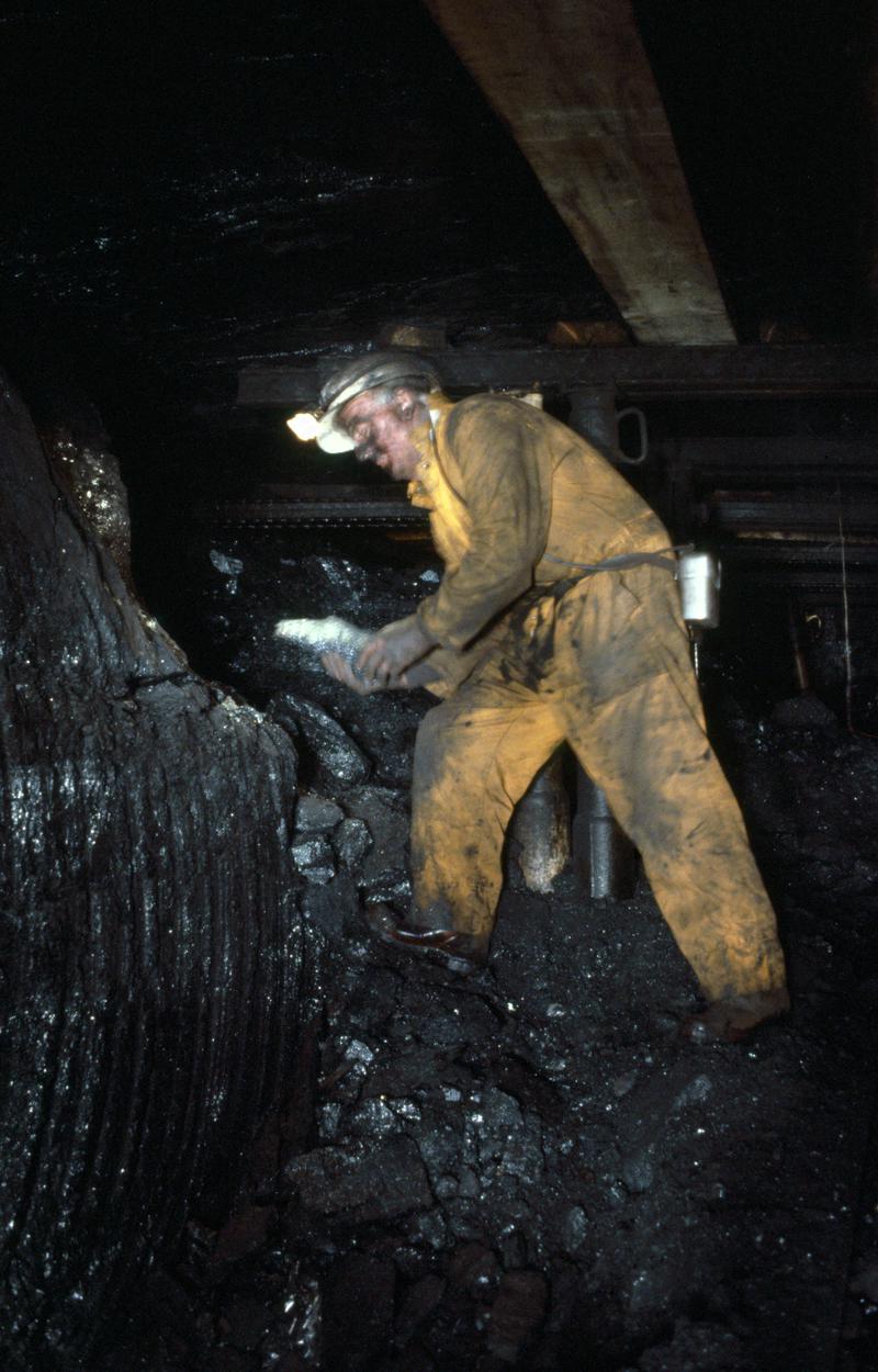 Colour film slide showing a man at the coalface, Oakdale Colliery 21 May 1981.