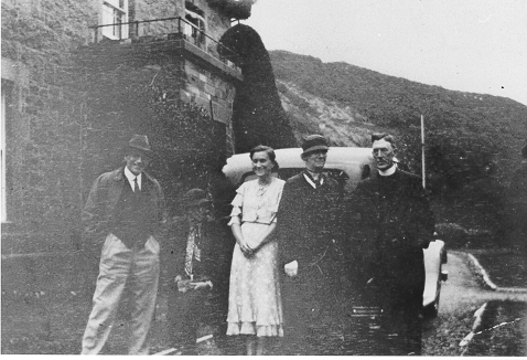 Dinorwig Quarry Hospital. Left to right: Gough Owen, Gough Owen's sister, Marie Therese Hughes, another of Gough Owen's sisters, the local Vicar (married to one of the sisters) - outside DQH. Note the entrance porch on front of building.