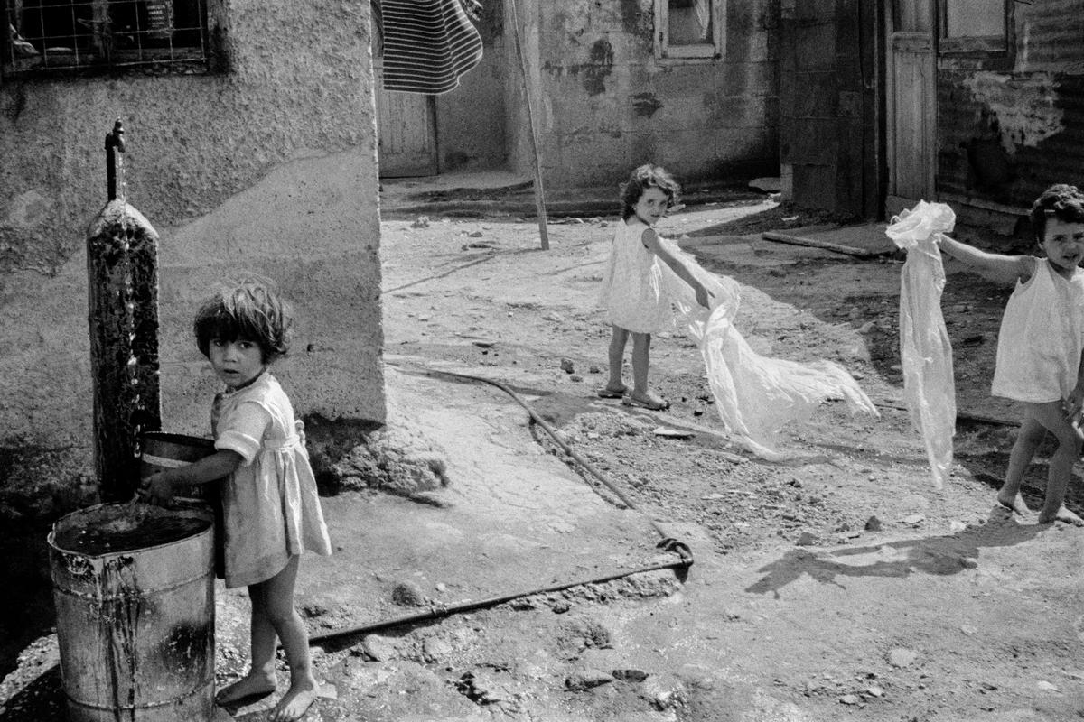 ITALY. Ischia. Children playing and collecting water. 1964.