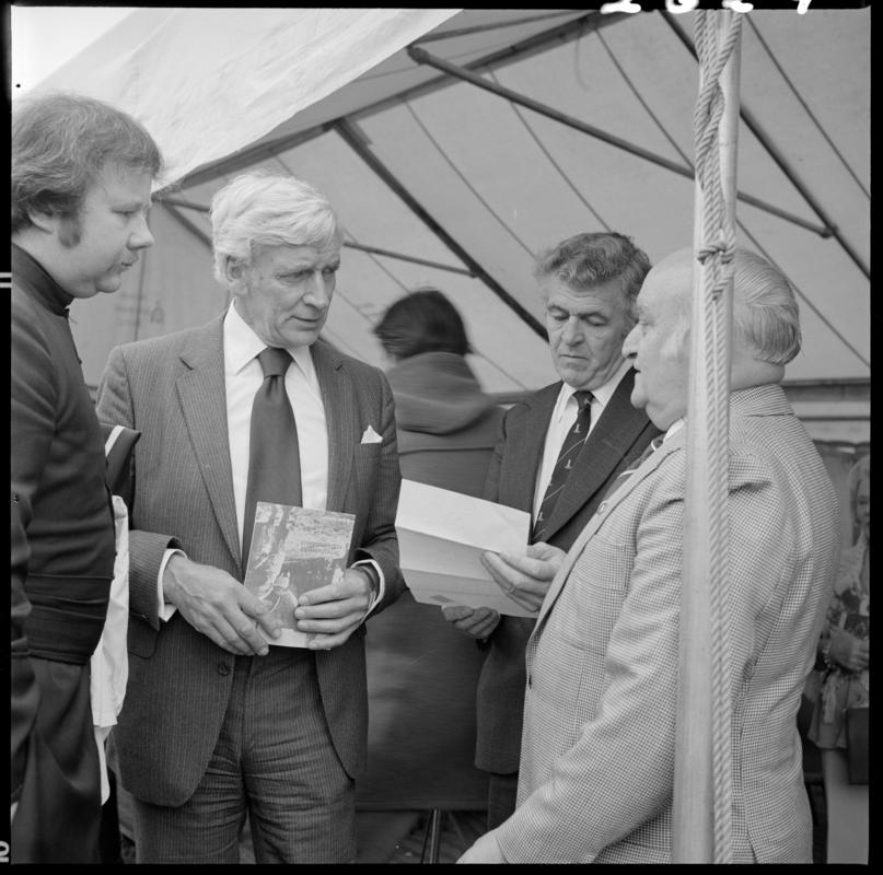 Black and white film negative showing the unveiling ceremony of the Senghenydd memorial, commemorating the 1913 Universal Colliery explosion.  The negative is undated but the ceremony took place in October 1981.  'Senghenydd' is transcribed from original negative bag.