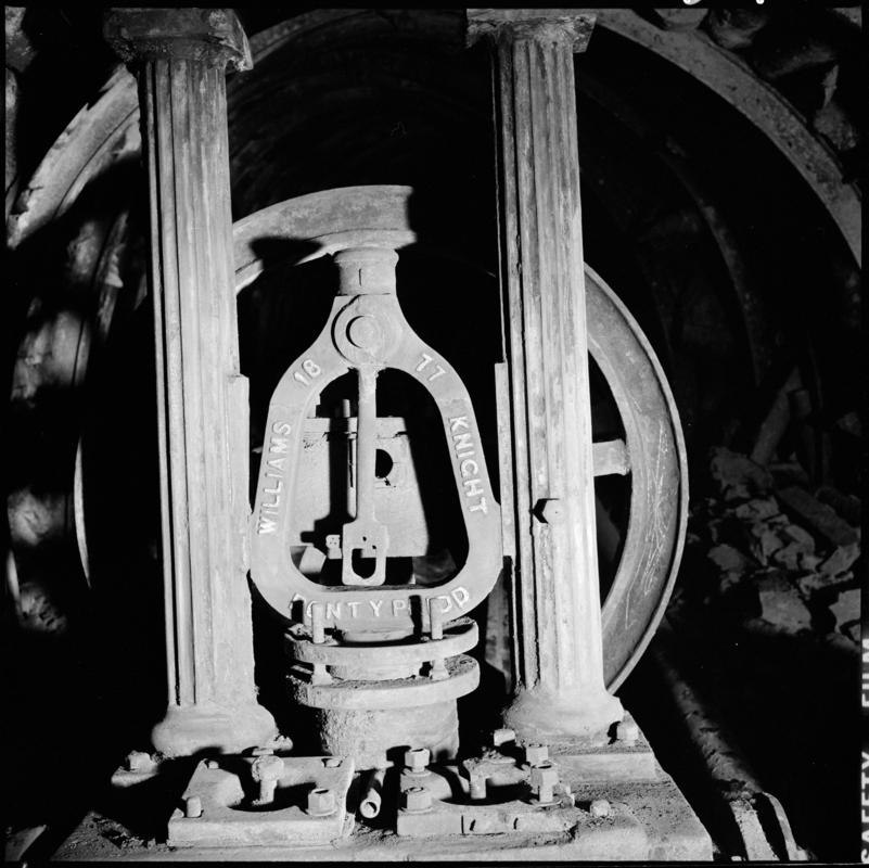 Black and white film negative showing the Old Steam pump made by Williams Knight of Pontypridd, underground at Deep Navigation Colliery.