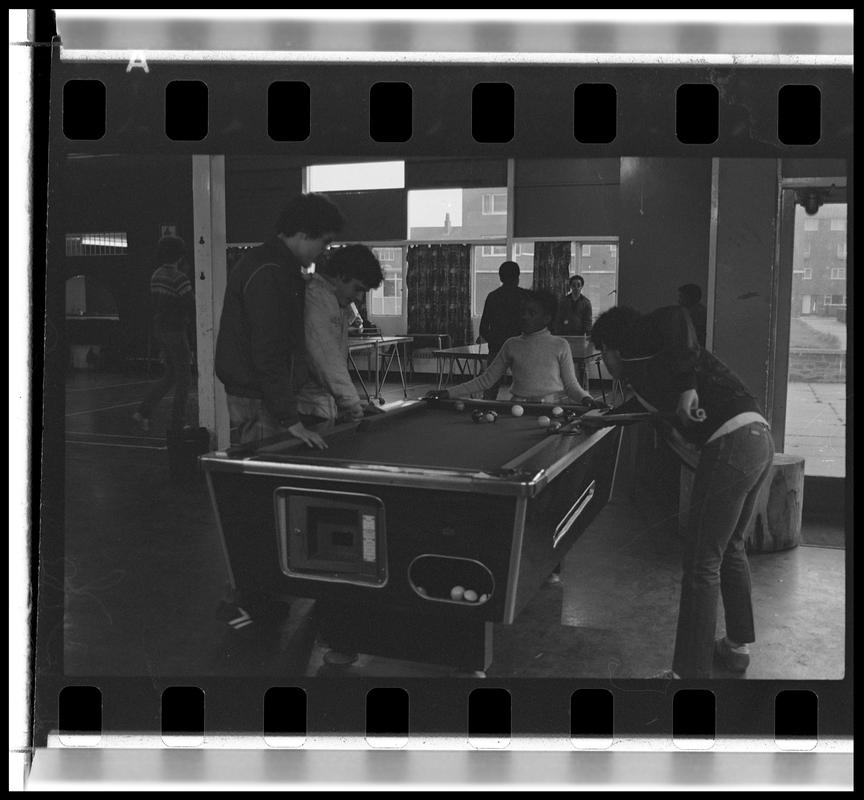 Teenagers playing pool at Butetown Youth Club.