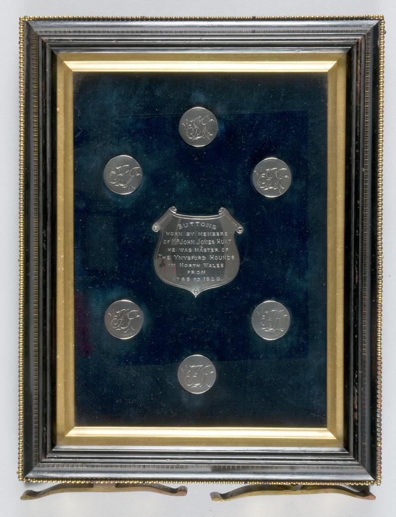 Cabinet containing silver Ynysfor hunt buttons