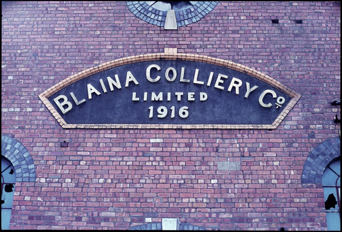 Colour film slide showing a 'Blaina Colliery Co Limited 1916' plaque on a colliery building,  Pantyffynnon Colliery , 26 February 1977.