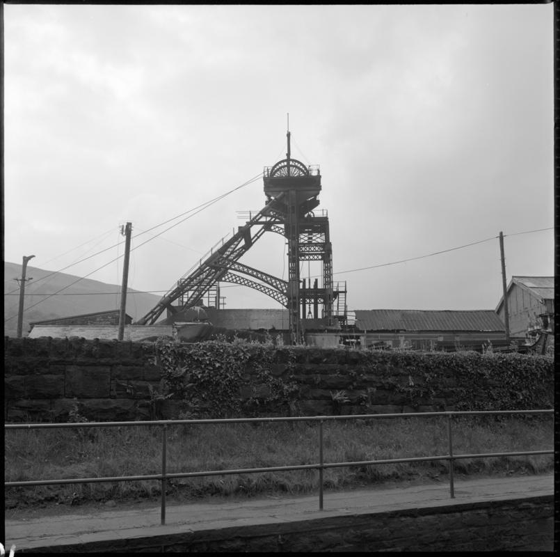 Black and white film negative showing a view of the headframe, Deep Duffryn Colliery 1975.  'Deep Duffryn Glam 1975' is transcribed from original negative bag.