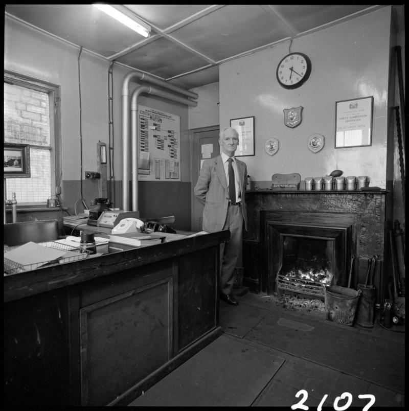 Black and white film negative showing Glyn Morgan, the final NCB manager, in his office at Big Pit Colliery, 28 November 1980.  'Blaenavon 28/11/80 Glyn Morgan' is transcribed from original negative bag.