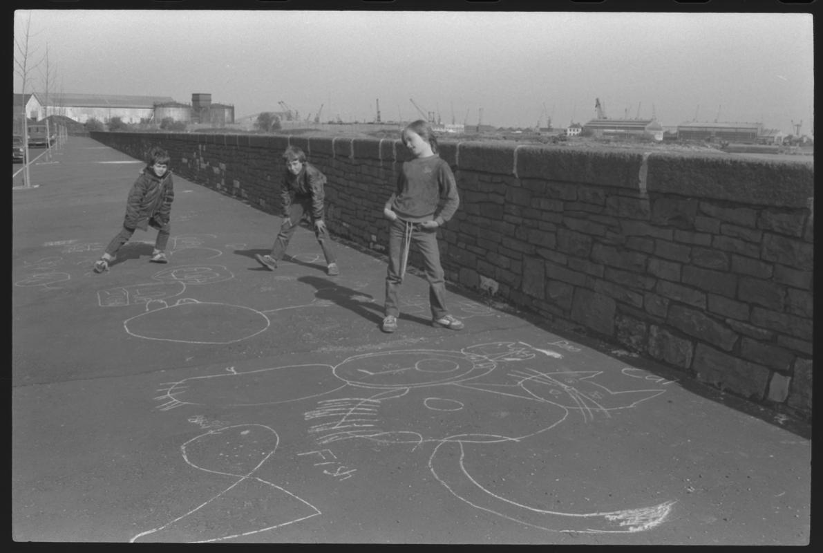 Children playing on pavement at Windsor Esplanade, Butetown.