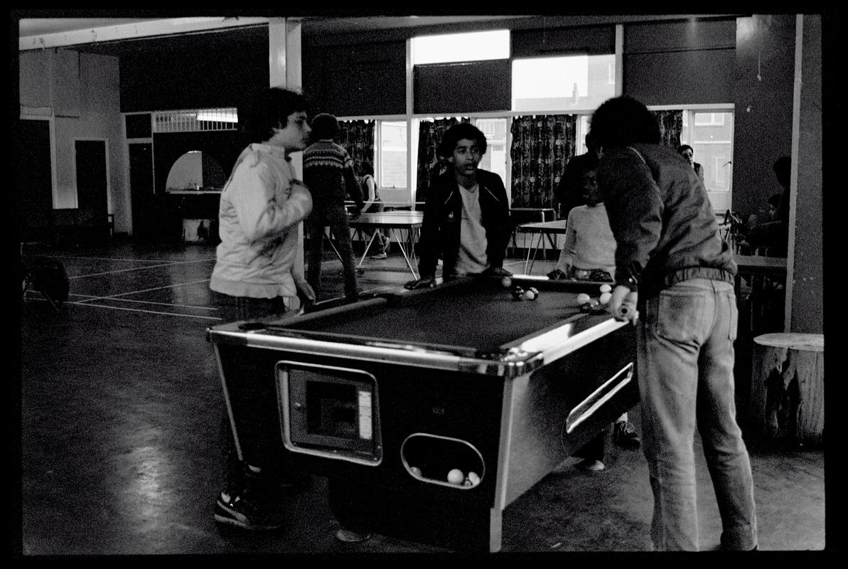 Teenagers playing pool at Butetown Youth Club.