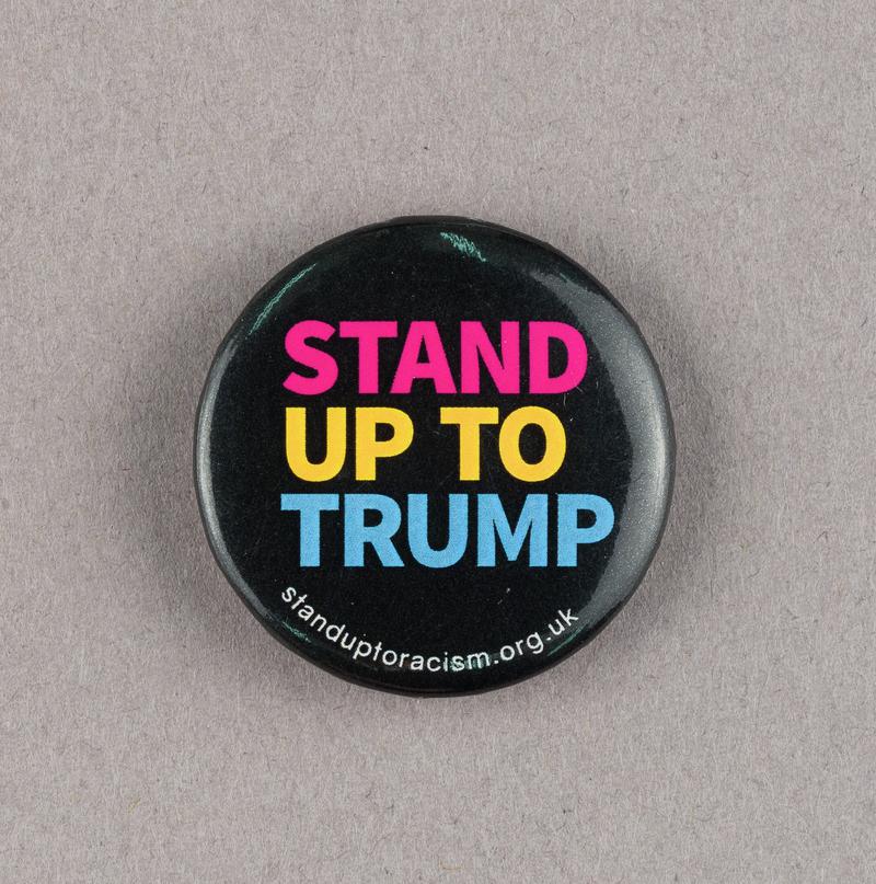 Stand Up to Trump badge. Produced by the Stand up to Racism campaign, 2018.