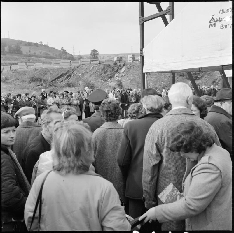 Black and white film negative showing the unveiling ceremony of the Senghenydd memorial, commemorating the 1913 Universal Colliery explosion.  The negative is undated but the ceremony took place in October 1981. 'Senghenydd' is transcribed from original negative bag.