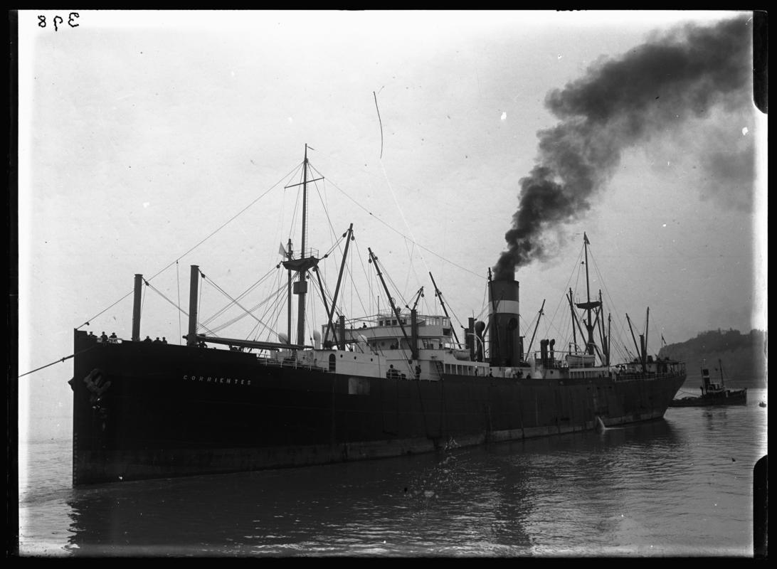 3/4 port bow view of S.S. CORRIENTES and tug at Penarth Head, c.1936.