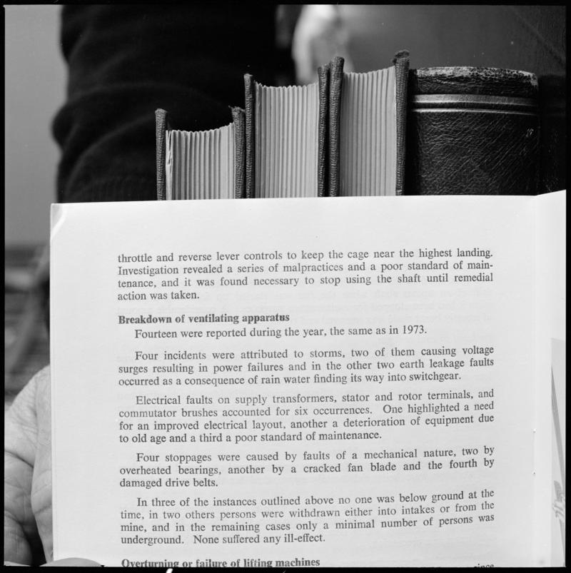 Black and white film negative showing text discussing the 'breakdown of ventilation', photographed from a publication.