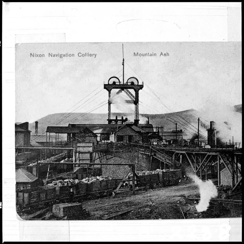 Black and white film negative of a photograph showing the headframe which was stabilised by steel cables, Nixon's Navigation Colliery c.1910.