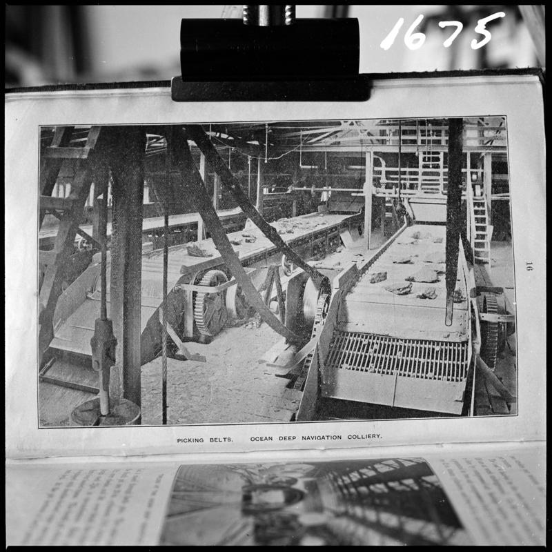Black and white film negative of a photograph showing 'picking belts, Ocean Deep Navigation Colliery.'