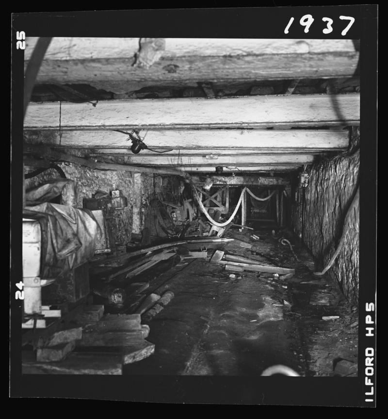 Black and white film negative showing an underground view of Oakdale Colliery, May 1980.  'Oakdale May 1980' is transcribed from original negative bag.