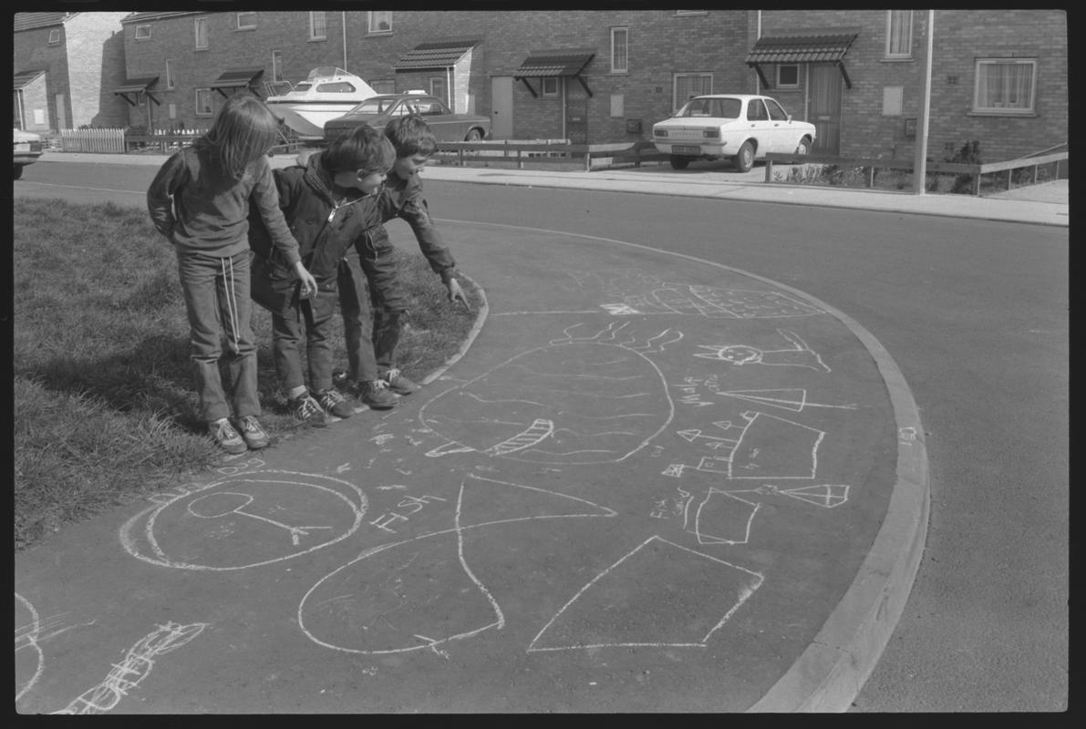 Children playing outside new houses at Eleanor Place, Butetown.