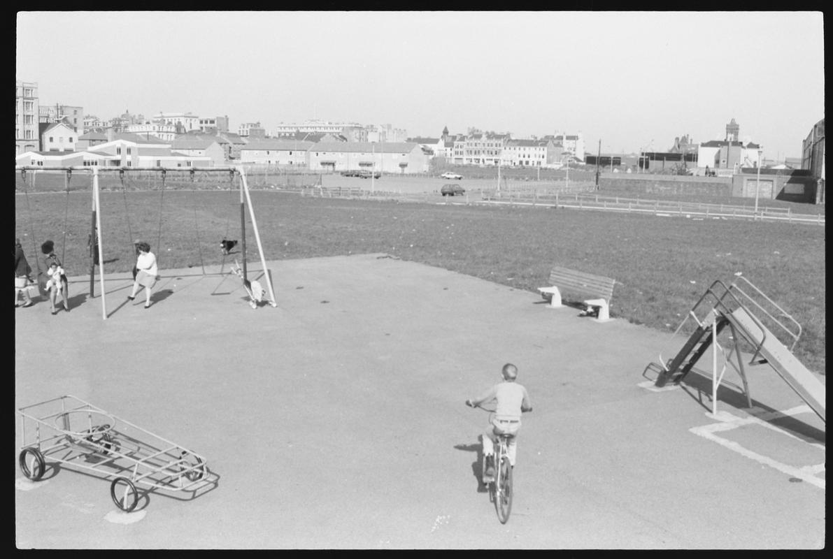 Children's playground at Louisa Place, with the Welsh Industrial and Maritime Museum building in background.