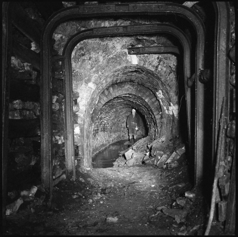 Black and white film negative showing man at the River Arch Level, Big Pit.