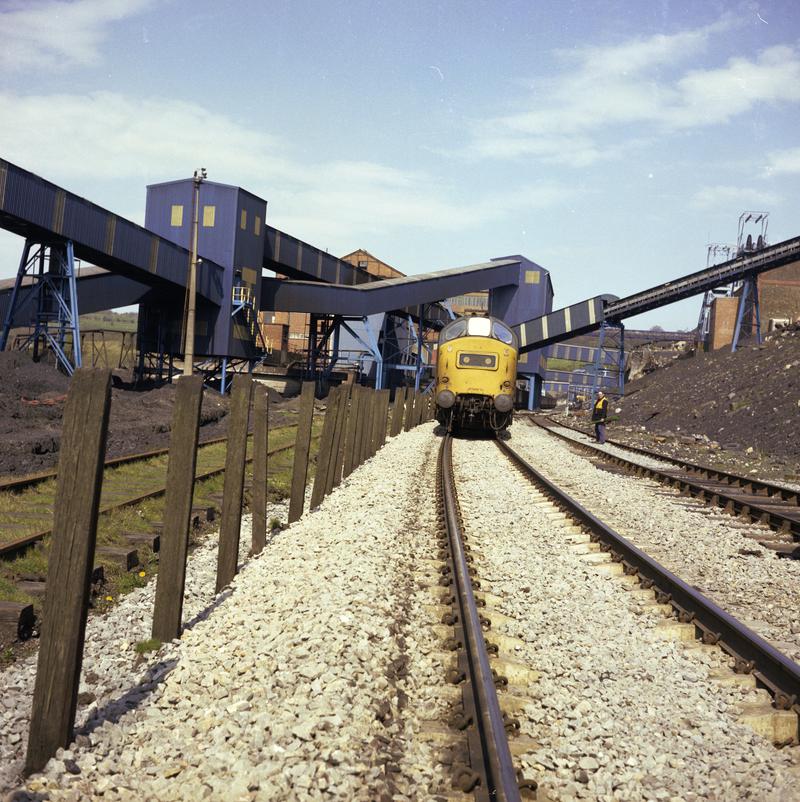 Colour film negative showing a locomotive passing through Oakdale Colliery, 16 April 1981.  'Oakdale 16/4/81' is transcribed from original negative bag.