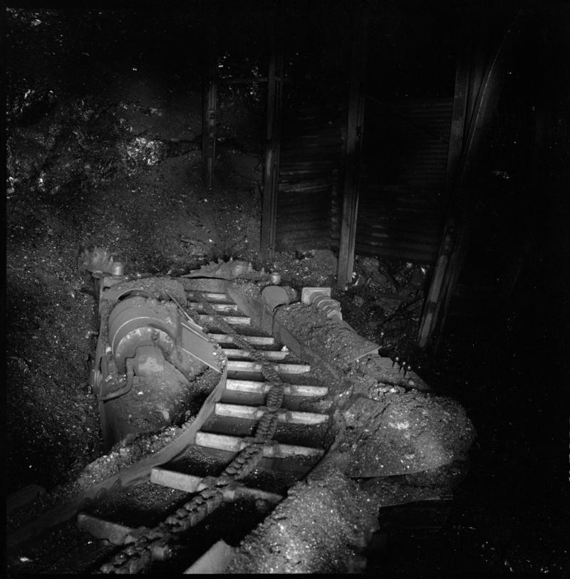 Black and white film negative showing a joy loader underground at Cwmgwili Colliery 1978.  'Cwmgwili' is transcribed from original negative bag.