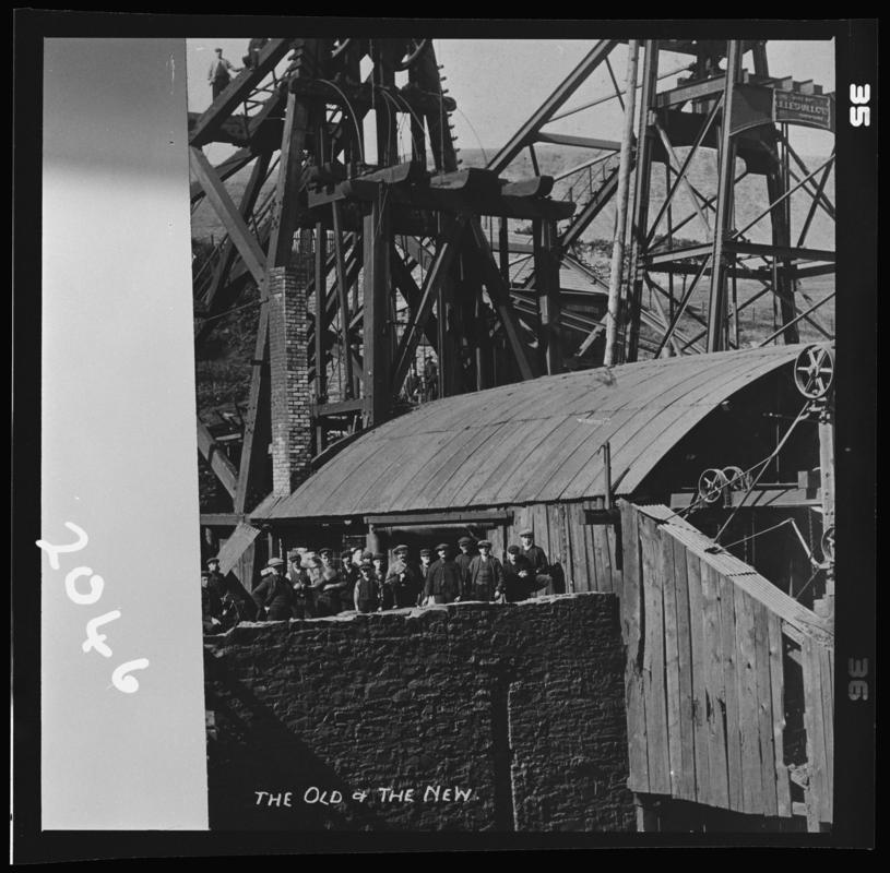 Black and white film negative of a photograph showing 'the old & the new' headgears, Ferndale no.4 Pit.