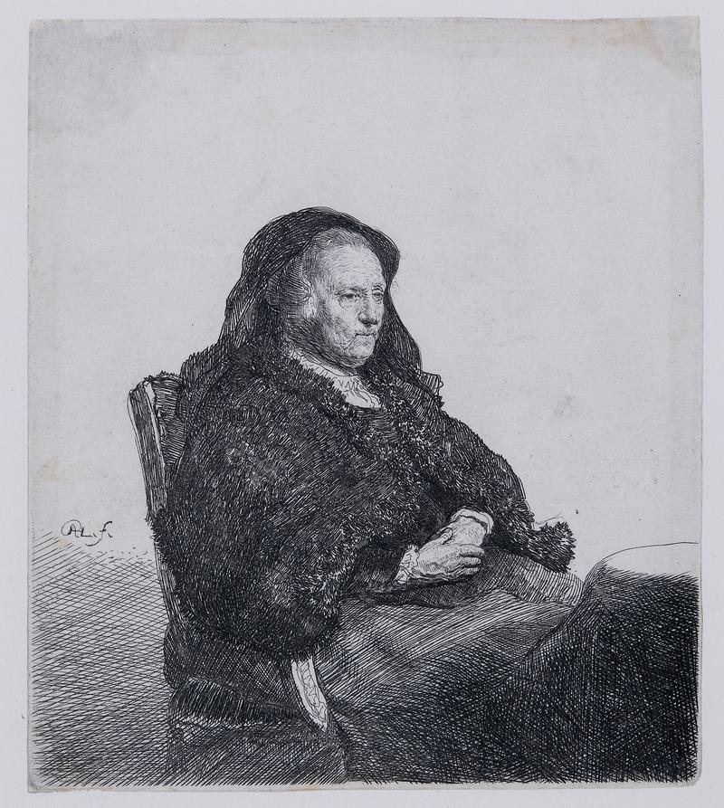 Mam Rembrandt yn eistedd wrth fwrdd yn edrych i’r dde